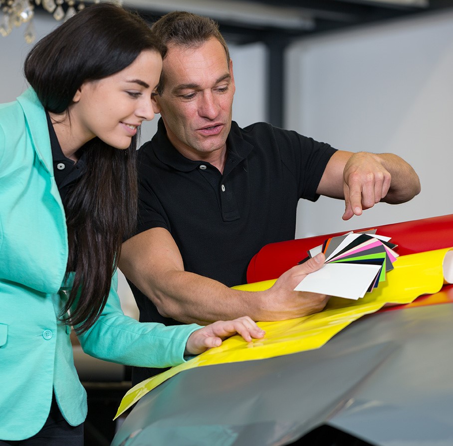 Designer and installer reviewing color swatches over wrap film